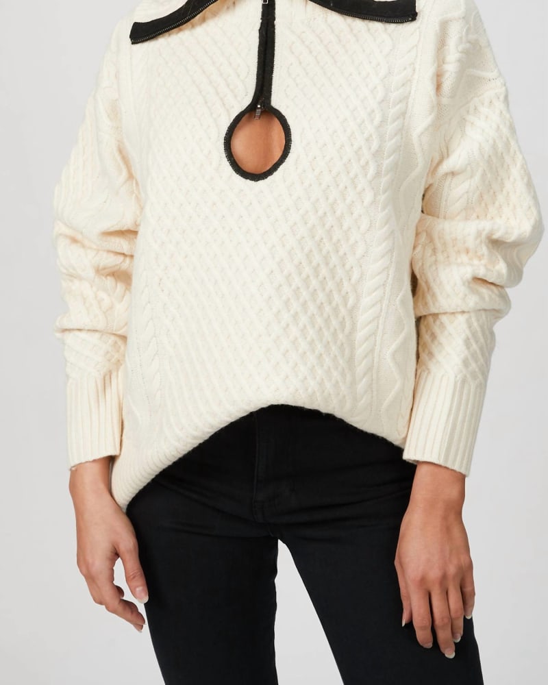 Front of a model wearing a size L Cable Knit Key Hole Sweater in Ivory in Ivory by WYNN HAMLYN. | dia_product_style_image_id:332587